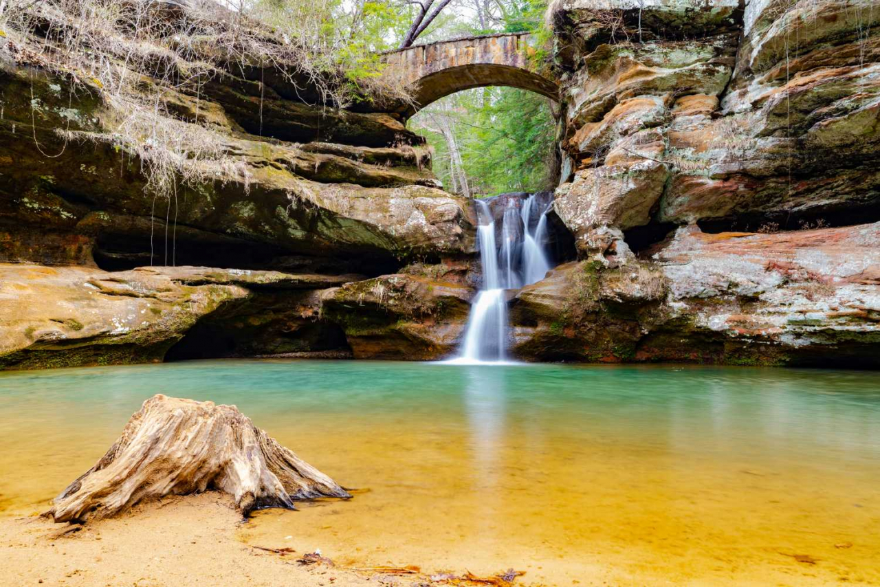 Waterfall with long exposure surrounded by rocks in Hocking Hills State Park, Ohio, USA