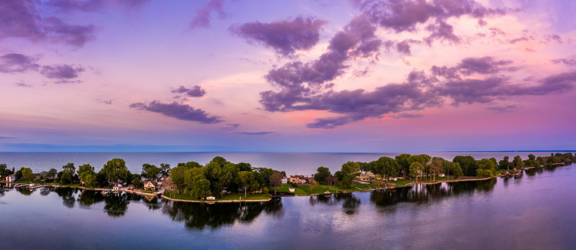 Aerial panorama of the Ceder Point peninsula at dusk, in Sandusky, Ohio, on the Erie lake